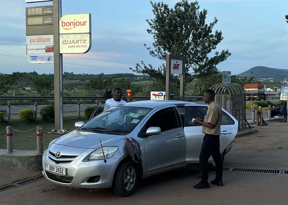 5 Filling up the tank and avoiding fish scents at a Total Gas station in Uganda 5 Filling up the tank and avoiding fish scents at a Total Gas station in Uganda